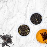 Tea and herbs on marble table top